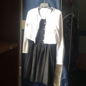 A black dress with a white cardigan
